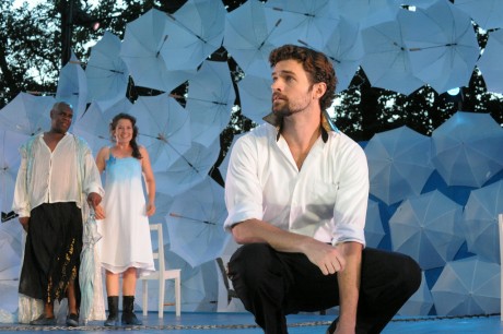 Prospero (Craig Wallace) and his daughter Miranda (Leah Filley) look on as Ferdinand (Alexander Korman) laments his father's fate in Olney Theatre Center's production of The Tempest (Photo: Stan Barouh)