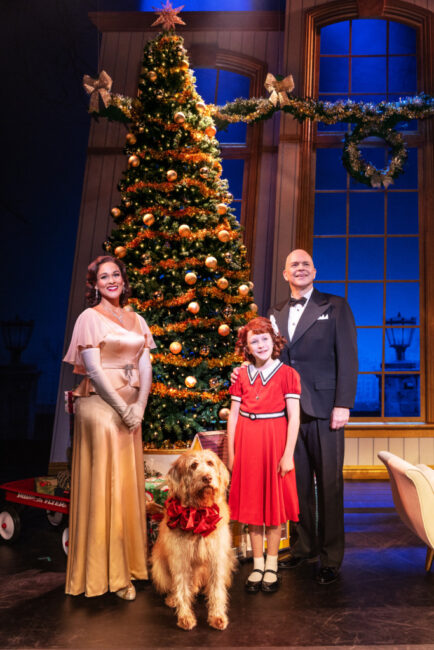 Julie Nicole Hunter (left) as Grace with Kevin (center-left) as Sandy, Hazel Vogel (center-right) as Annie, and Christopher Swan (right) as Oliver Warbucks in Annie. 📷 Matthew Murphy