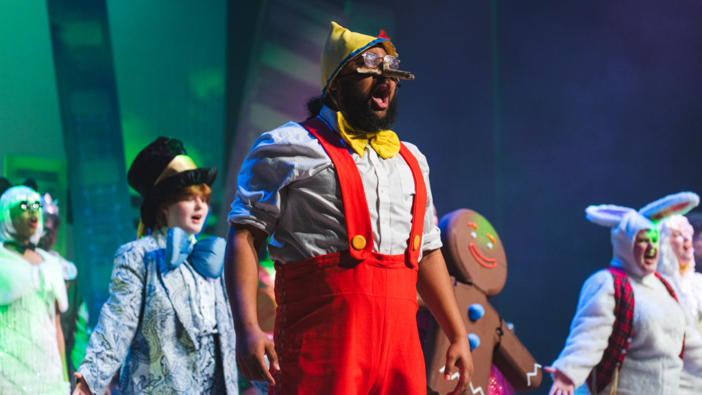 Eric Bray Jr. (center) a Pinocchio and the ensemble of Shrek at Phoenix Festival Theatre 📷 Matthew Peterson Photography