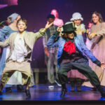 Colton Roberts (left) as Oliver with Maxton Folmer (right) as The Artful Dodger and the company of Oliver! at Tidewater Players ???? Matthew Peterson