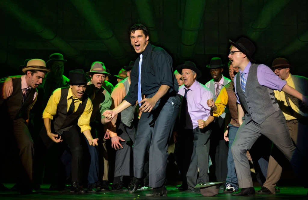 Danny Bertaux (center) as Sky Masterson and The Gamblers in Guys & Dolls at HCST 📸 Neil Rubino