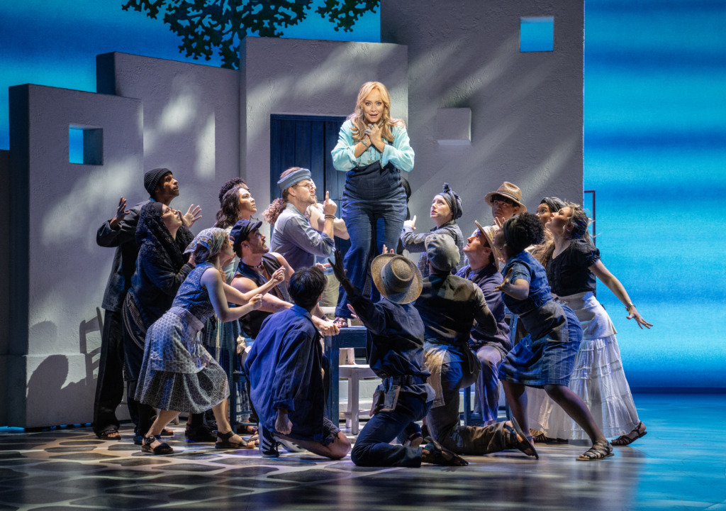 Christine Sherrill (center) as Donna Sheridan and the company of Mamma Mia 25th Anniversary Tour 📷 Joan Marcus