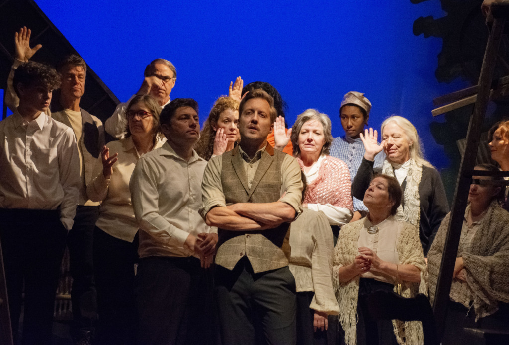 Matthew Sean Mitchell (center) as Simon Stimson and the company of Our Town at Manor Mill Playhouse 📷 Zoe Leonard 