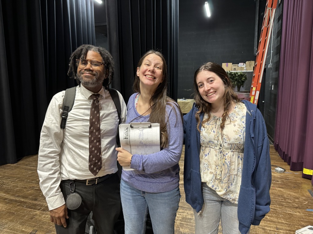 Levar Betts (left) Music Director with Sarah O'Hara (center) Director and DJ Flickinger (right) Stage Manager in rehearsal for Tidewater Players' A Christmas Carol