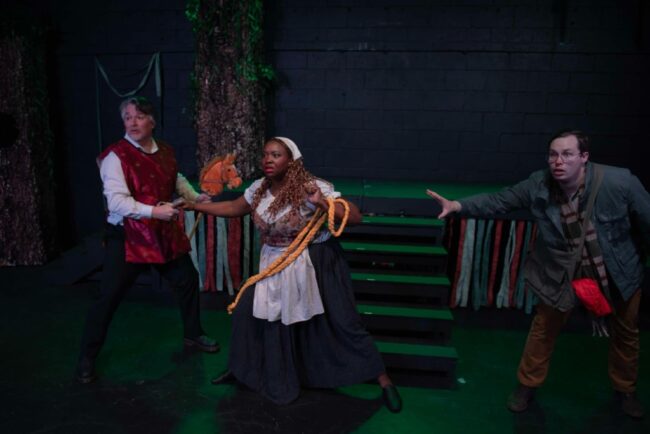 Jerry Jones (left) as the Steward with Breonna Lewis (center) as Baker's Wife and Pat Collins (right) as the Baker in Into The Woods at Street Lamp Community Theatre 📷 Andrew DiMaio